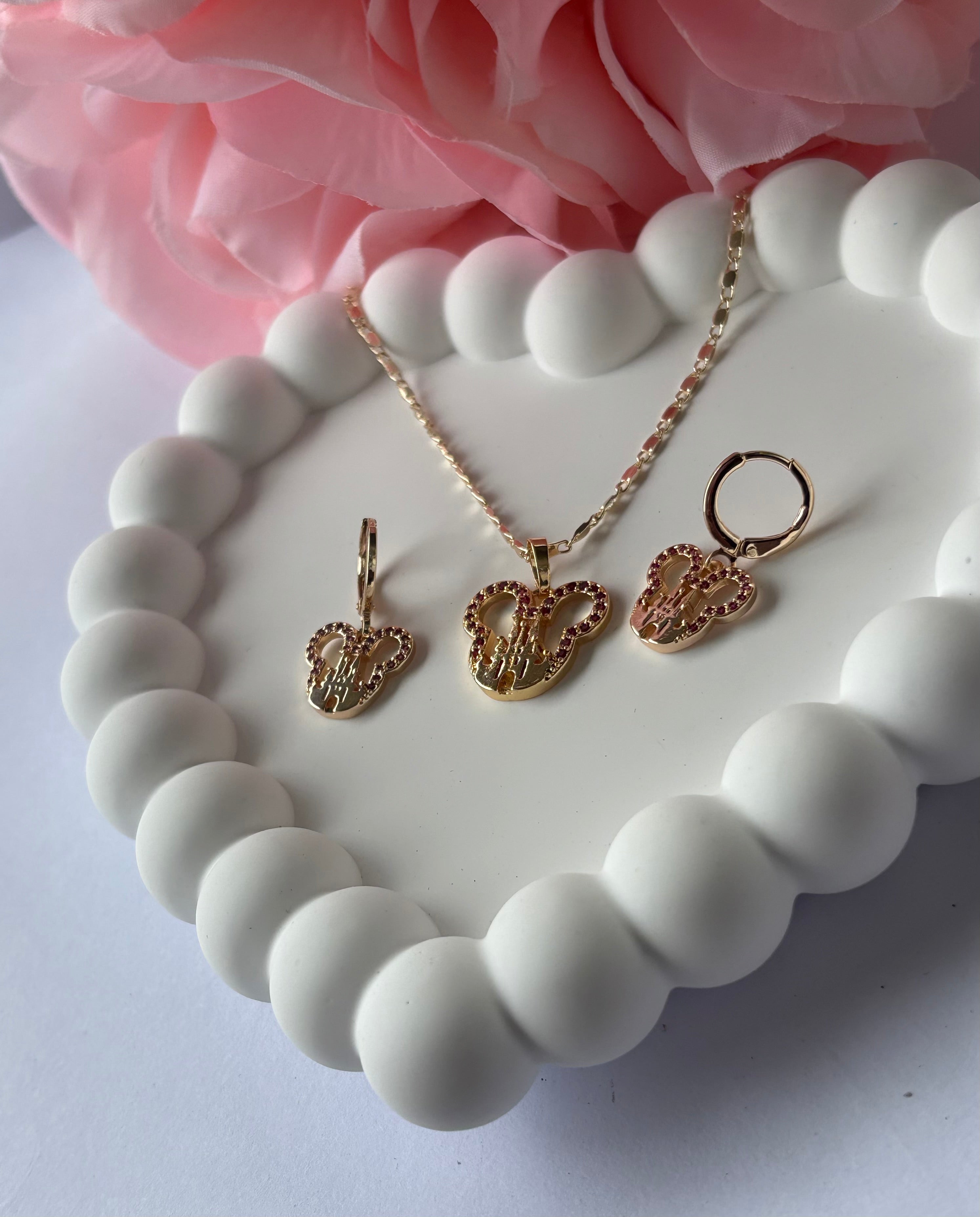 Fairytale-inspired castle jewelry set with pink jewel details